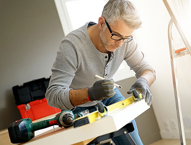 Man assembling DIY furniture kit