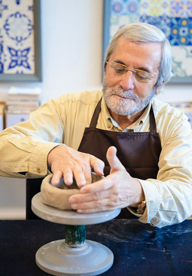 Man throwing a pot on a wheel