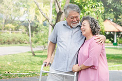Retired couple walking in park