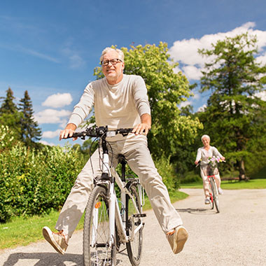 couple cycling on a path