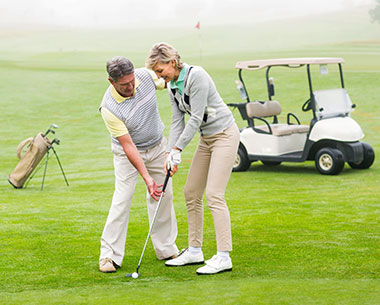 couple golfing