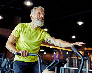 Healthy retired man working out on a treadmill