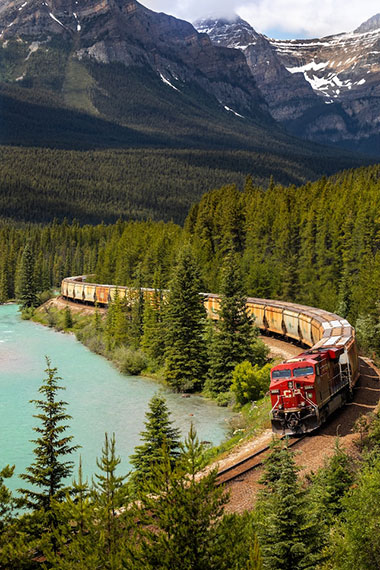 Canadian train traveling through Canadian wilderness