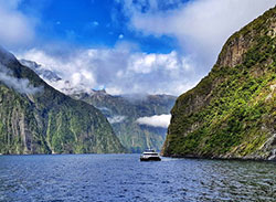 Boat cruising Milford Sound