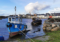 Boats on shore in Galway