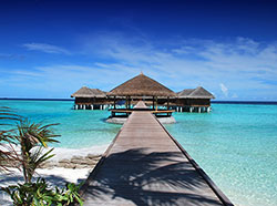 Resort huts over water in Maldives