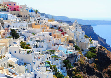 Houses clinging to cliff on Santorini
