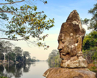Temple statue overlooking river